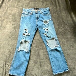Calvin Klein flare leg tattered jeans